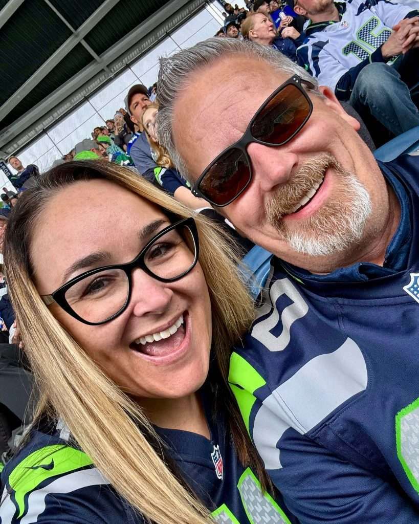Digital Marketing Agency owner at football game with husband