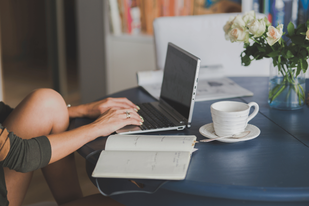 Woman on laptop using AI for content creation with real-time updates