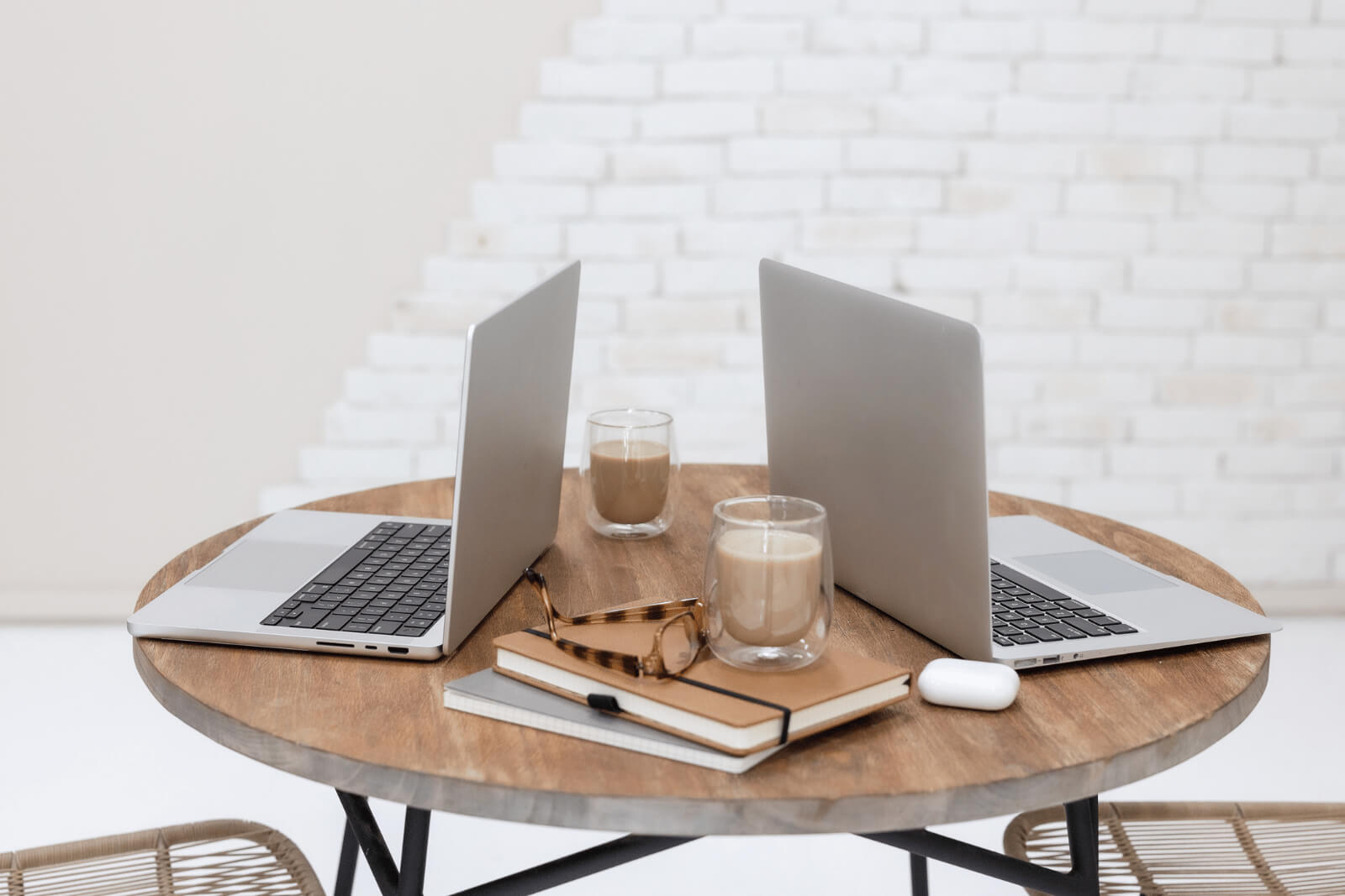 two laptops and coffee for employees elevating SEO with free tools